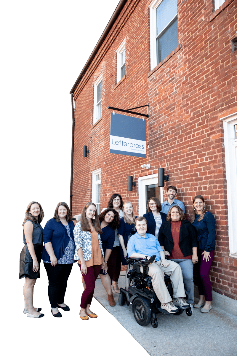 Letterpress team of marketing specialists in front of the Farmville office.