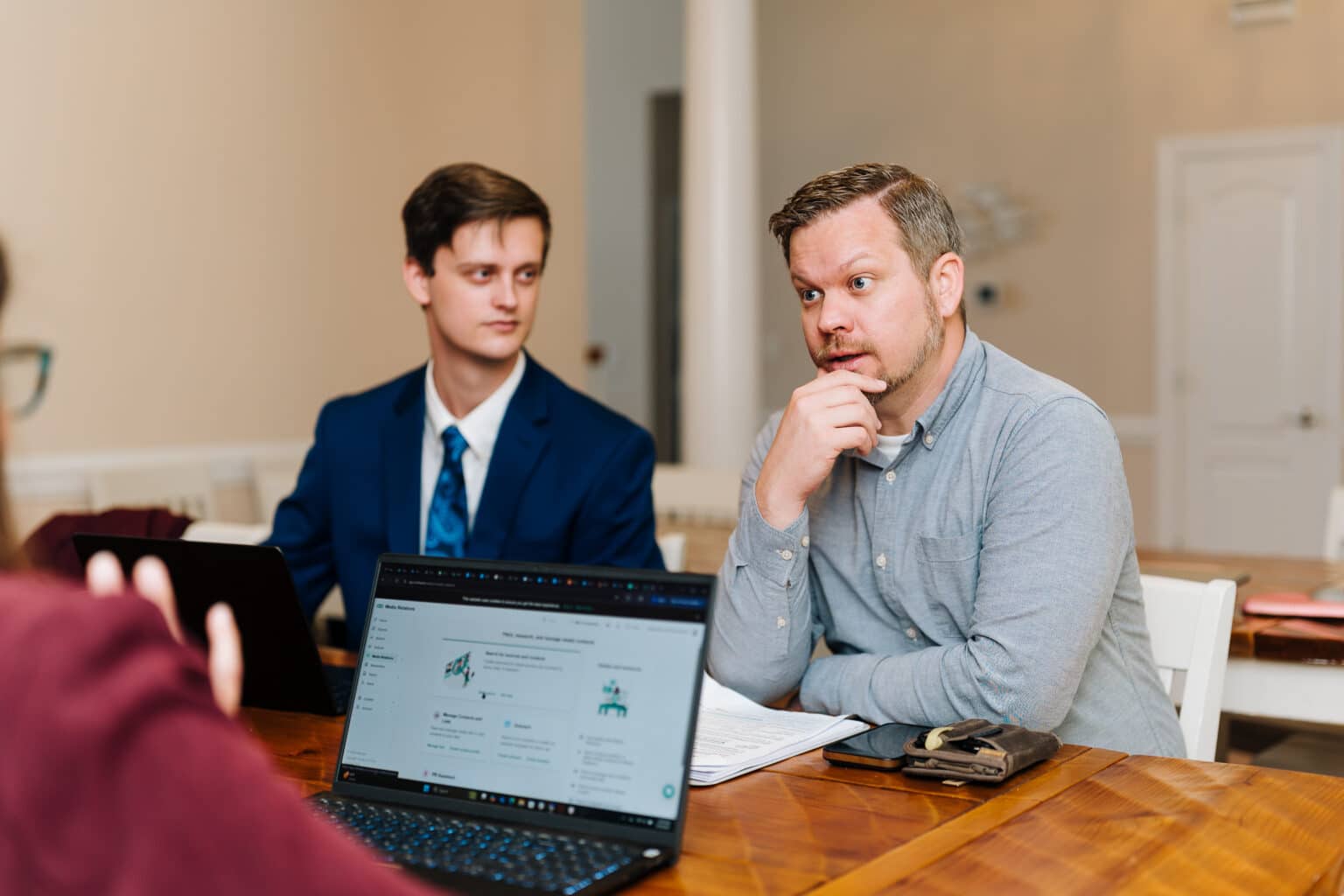 Letterpress Communications Advertising Specialist & Content Creator Chad Thompson talks with his teammates.